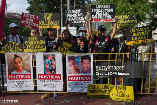 Photos of the casualties of the war on drugs are seen during the protest. Student groups, activists, and the mothers of those who were killed during...