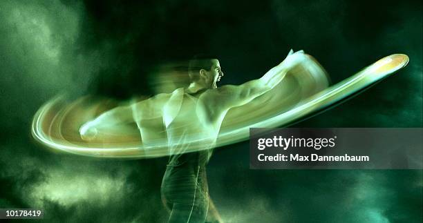 man throwing discus-blurred - discus stock pictures, royalty-free photos & images