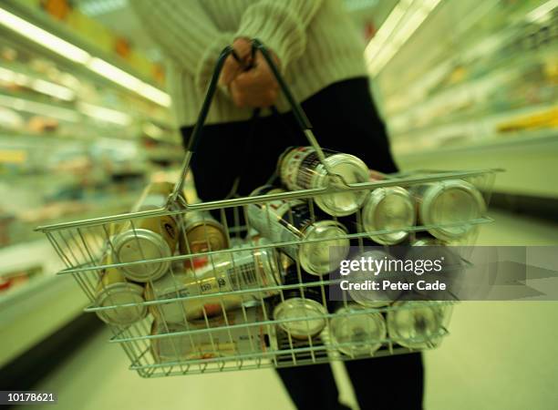 man in supermarket with basket full of beer - buying beer stock-fotos und bilder