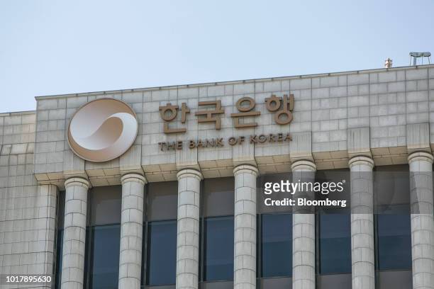 Signage for Bank of Korea is displayed atop the central bank's headquarters building in Seoul, South Korea, on Thursday, Aug. 16, 2018. While...