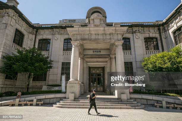 Pedestrian walks past the entrance to the Bank of Korea museum at the central bank's headquarters in Seoul, South Korea, on Thursday, Aug. 16, 2018....