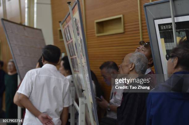 Elderly people view marriage-seeking leaflets during a blind date event for Chinese valentine's day on August 17, 2018 in Harbin, China.More and more...