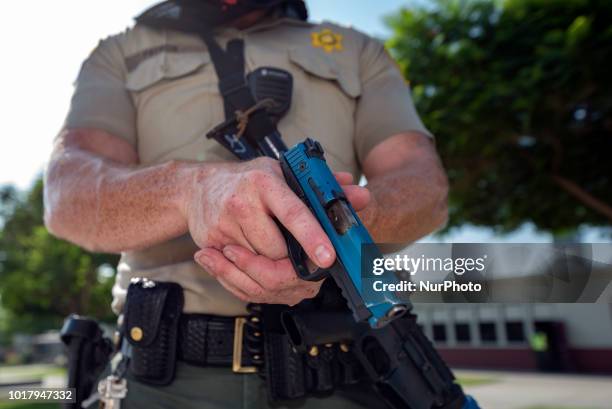 Los Angeles Sheriffs deputy participates in an active shooter drill in a high school near Los Angeles, California on August 16, 2018.