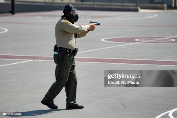 Los Angeles Sheriffs deputy during an active shooter drill in a high school near Los Angeles, California on August 16, 2018.