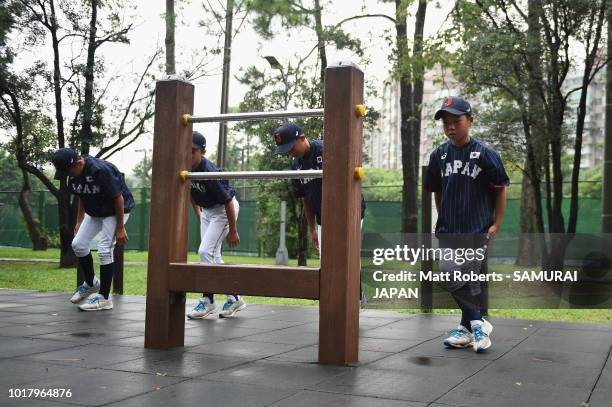 Players of Japan warm up prior to the BFA U-12 Asian Championship Super Round match between South Korea and Japan at Youth Park Baseball Field on...