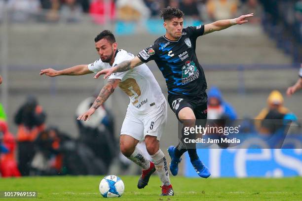 Alan Mendoza of Pumas fights for the ball with Angelo Sagal of Pachuca during the fourth round match between Pumas UNAM and Pachuca as part of the...