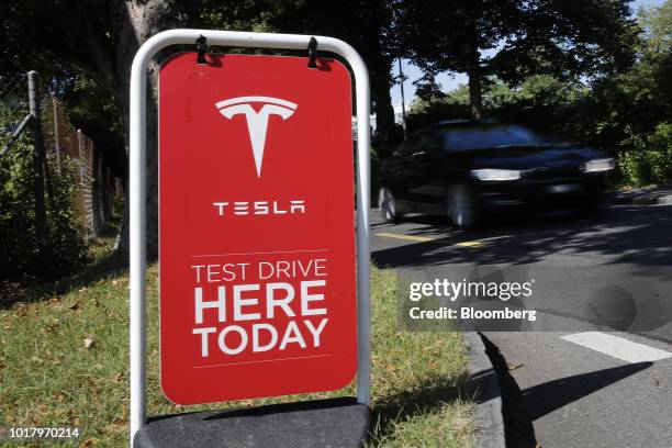 Test drive advertisement stands outside a Tesla Inc. Store in Bern, Switzerland, on Thursday, Aug. 16, 2018. Tesla chief executive officer Elon...