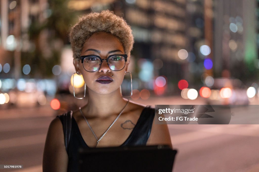 Businesswoman Portrait at night using tablet