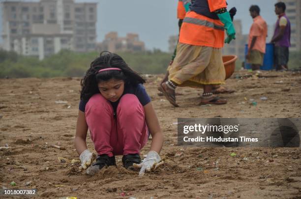 Local residents and volunteers participate during a beach cleanup campaign at Versova, on August 15, 2018 in Mumbai, India.