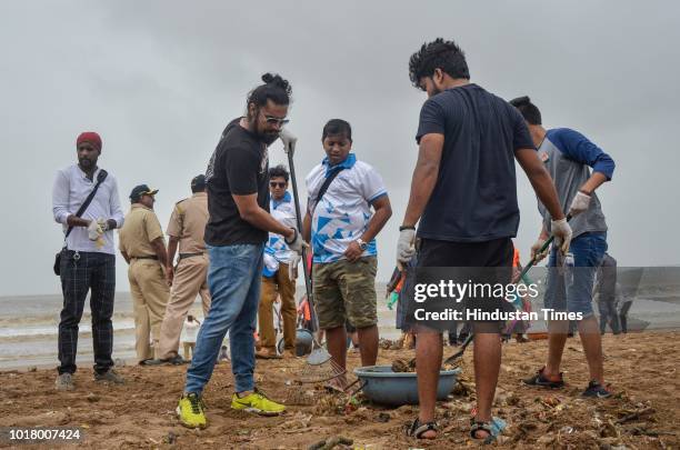 Bollywood actor Randeep Hooda participates during a beach cleanup campaign at Versova, on August 15, 2018 in Mumbai, India.