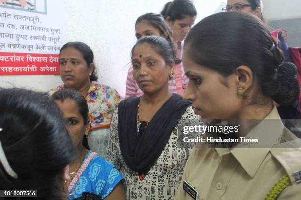 Parents of students at hospital, on August 16, 2018 in Mumbai, India. 12 girls and four boys of the Class VII, including a staff member ate the dal...