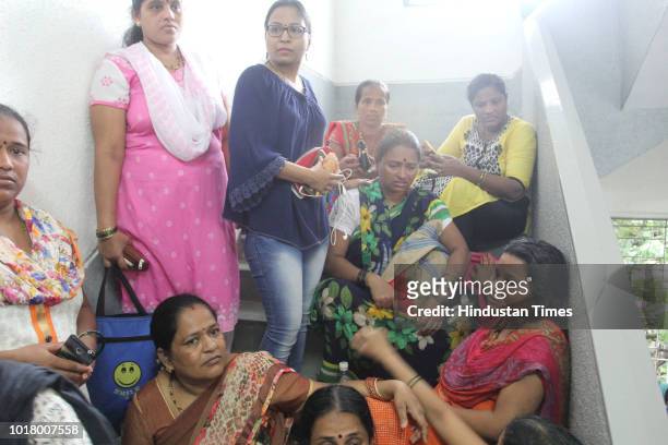 Parents of students at hospital, on August 16, 2018 in Mumbai, India. 12 girls and four boys of the Class VII, including a staff member ate the dal...