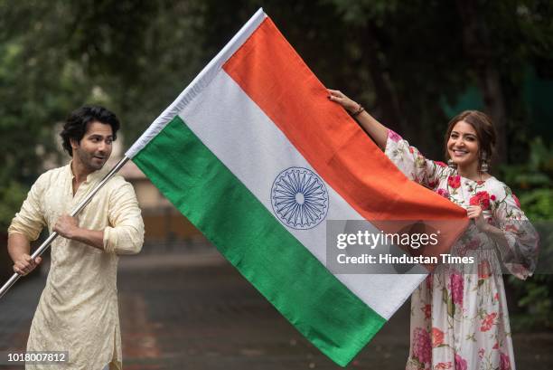 Bollywood actors Varun Dhawan and Anushka Sharma pose with the National Flag during an exclusive shoot with Hindustan Times for the Independence Day...