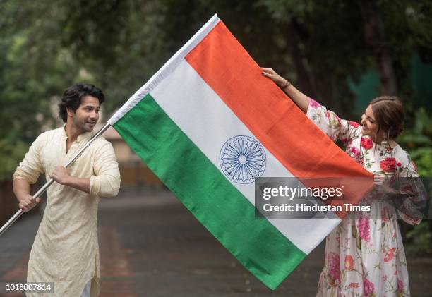 Bollywood actors Varun Dhawan and Anushka Sharma pose with the National Flag during an exclusive shoot with Hindustan Times for the Independence Day...