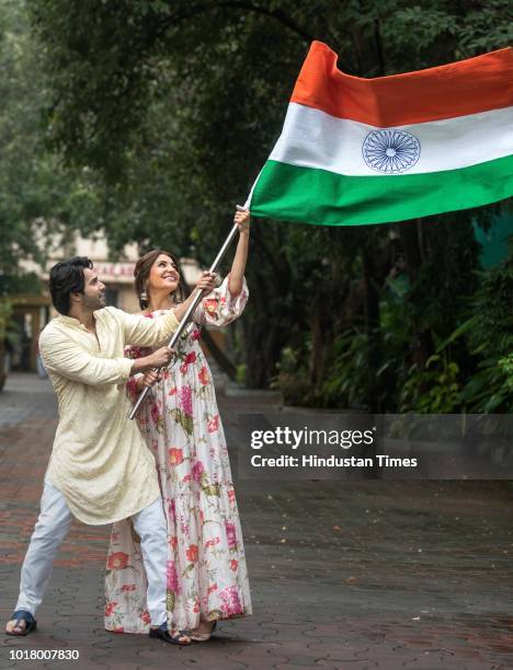 Bollywood actors Varun Dhawan and Anushka Sharma pose with the National Flag during an exclusive shoot with Hindustan Times for the Independence Day...