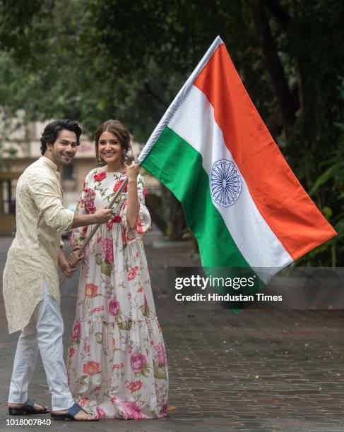 Bollywood actors Varun Dhawan and Anushka Sharma pose with the National Flag during an exclusive shoot with Hindustan Times for the Independence Day...