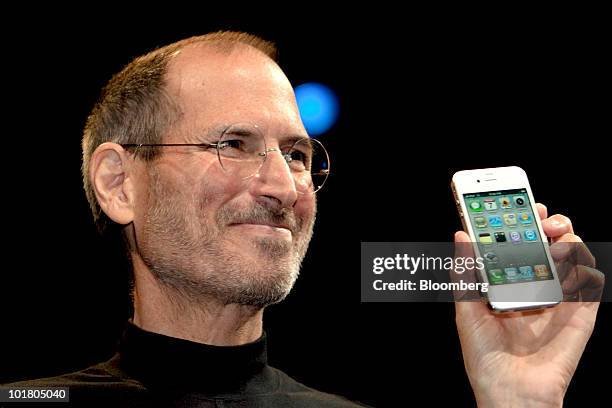 Steve Jobs, chief executive officer of Apple Inc., unveils the iPhone 4 during his keynote address at the Apple Worldwide Developers Conference in...