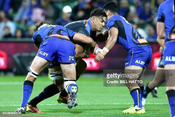 Ben Gunther of Japan's Wild Knights attempts to break through Leon Power and Henry Taefu of Western Force during their World Series rugby match...