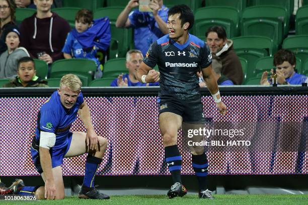 Kenki Fukuoka of Japan's Wild Knights celebrates after scoring a try beside Andrew Deegan of Western Force during their World Series rugby match in...
