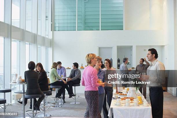group of people socializing, gathering - businessperson breakfast stock-fotos und bilder