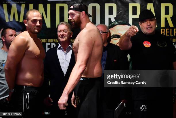 Belfast , United Kingdom - 17 August 2018; Tyson Fury, centre, faces off with Francesco Pianeta ahead of their bout during the Windsor Park boxing...