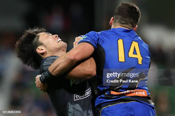 Keisuke Moriya of the Wild Knights gets tackled by Clay Uyen of the Force during the World Series Rugby match between the Force and Wild Knights at...