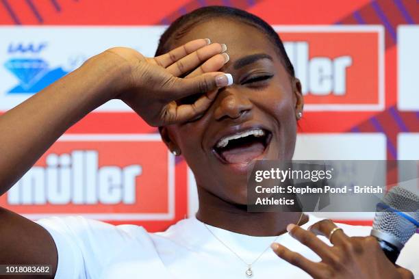 Dina Asher-Smith of Great Britain attempts to copy the goal celebration pose of Tottenham Hotspur player Dele Ali during a press conference ahead of...