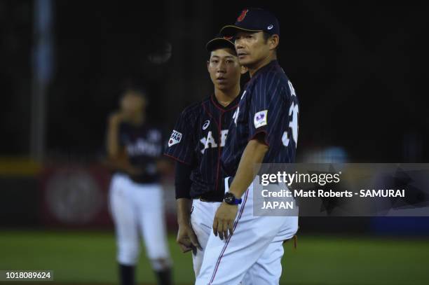 Manager, Toshihisa Nishi of Japan speaks with Kota Tamaki of Japan in the bottom of the fifth inning during the BFA U-12 Asian Championship Super...