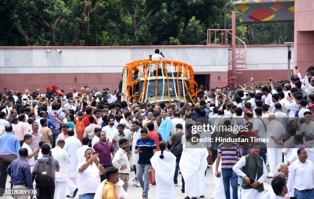 Mortal remains of former Prime Minister Atal Bihari Vajpayee reaches BJP headquarters, where party workers and leaders paid their tributes on August...