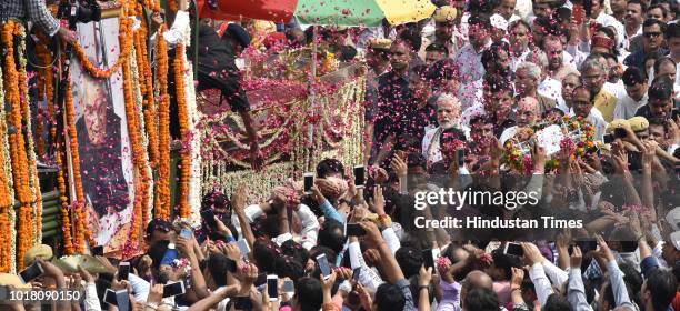 Prime Minister Narendra Modi and BJP President Amit Shah take part in the funeral procession of former Prime Minister Atal Bihari Vajpayee at ITO...