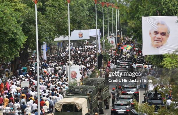 Followers of former Prime Minister Atal Bihari Vajpayee take part in his funeral procession along at DDU Marg on August 17, 2018 in New Delhi, India....