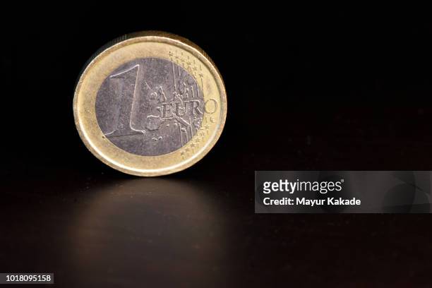 closeup of one euro coin - 1 euro stock-fotos und bilder