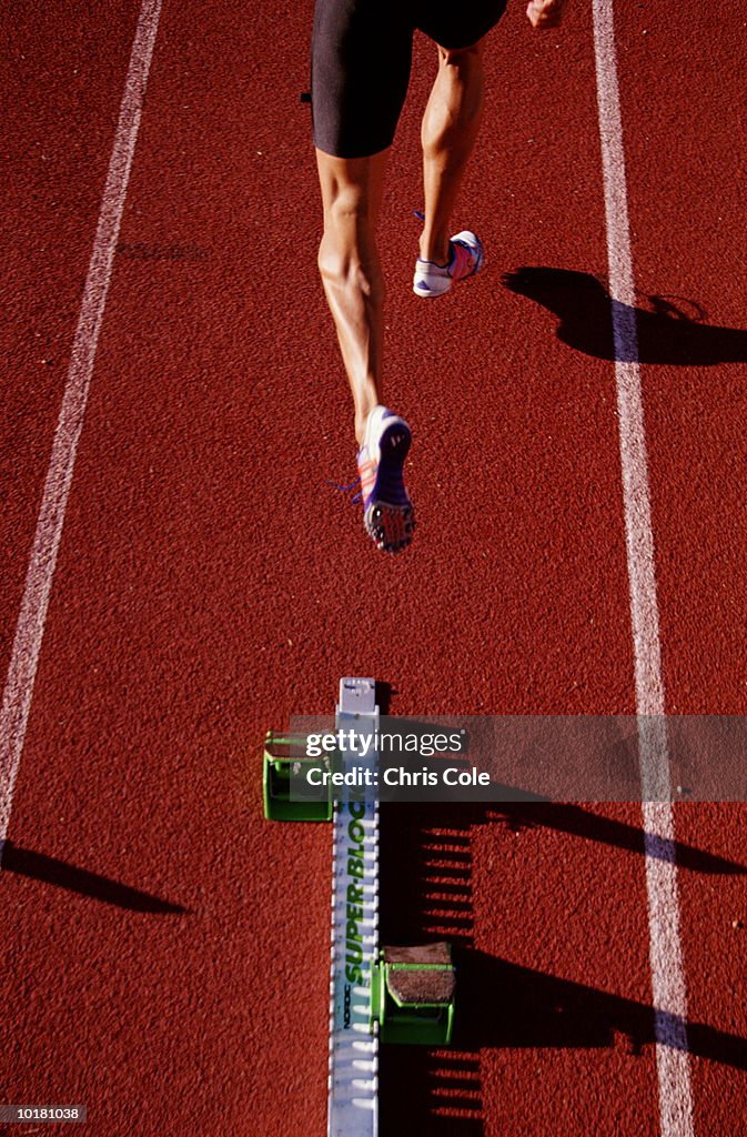 LEGS OF MALE SPRINTER RUNNING, STELLENBOSCH, SOUTH AFRICA