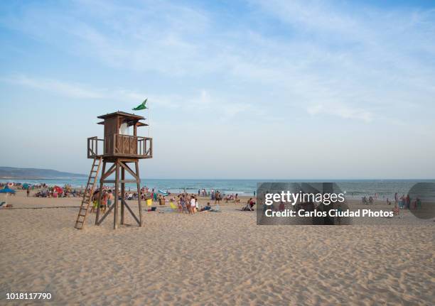 beach of barbate (cadiz, spain) in a clear day of summer - lifeguard tower fotografías e imágenes de stock