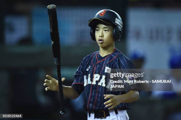 Kai Yatake of Japan reacts at bat in the top of the second inning during the BFA U-12 Asian Championship Super Round match between South Korea and...