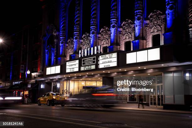 Vehicles pass in front of the Landmark Century Centre Cinema in Chicago, Illinois, U.S., on Thursday, Aug. 16, 2018. Amazon.com Inc. Is in the...