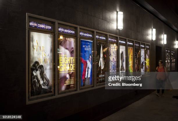 Movie posters are displayed outside of the Landmark Century Centre Cinema in Chicago, Illinois, U.S., on Thursday, Aug. 16, 2018. Amazon.com Inc. Is...