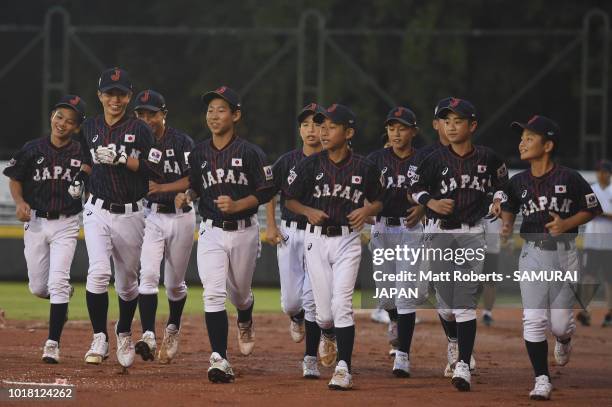 Players of Japan warm up prior to the BFA U-12 Asian Championship Super Round match between South Korea and Japan at Youth Park Baseball Field on...