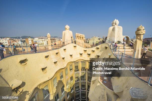 casa milà (la pedrera) roof architecture with the chimneys known as espanta bruixes (witch scarers) - la pedrera stock pictures, royalty-free photos & images