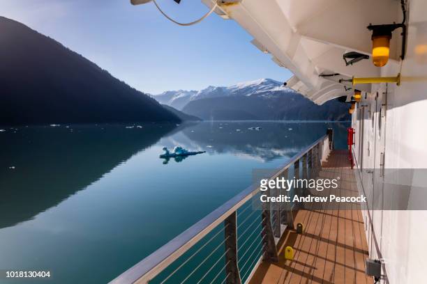 a small ship is cruising in endicott arm - alaska cruise stock pictures, royalty-free photos & images