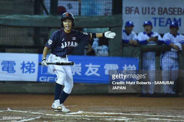 Shijiro Uno of Japan signals to his team mate in the top of the first inning during the BFA U-12 Asian Championship Super Round match between South...