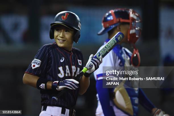 Yamato Sento of Japan smiles at bat in the top of the seconf inning during the BFA U-12 Asian Championship Super Round match between South Korea and...