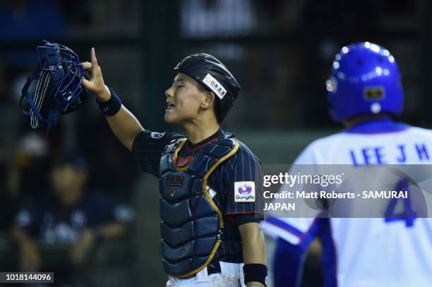 Taisei Kuriyama of Japan signals to his team mates in the bottom of the third inning during the BFA U-12 Asian Championship Super Round match between...