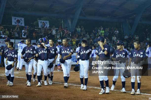 Players of Japan looks dejected after the BFA U-12 Asian Championship Super Round match between South Korea and Japan at Youth Park Baseball Field on...
