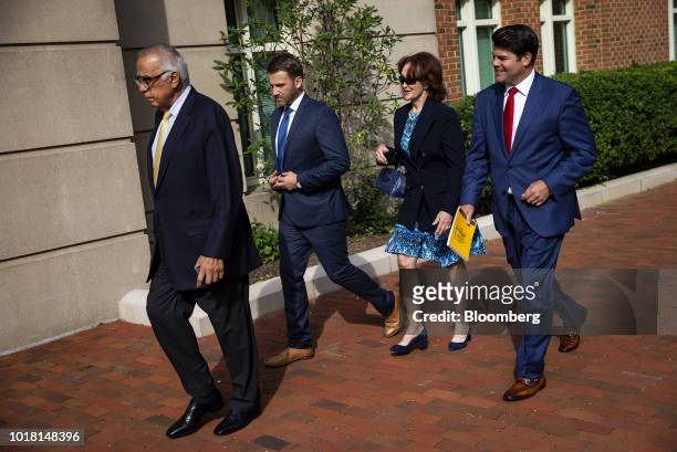 Kathleen Manafort, wife of former Donald Trump campaign manager Paul Manafort, second right, and Jason Maloni, spokesman for Manafort, right, arrive...