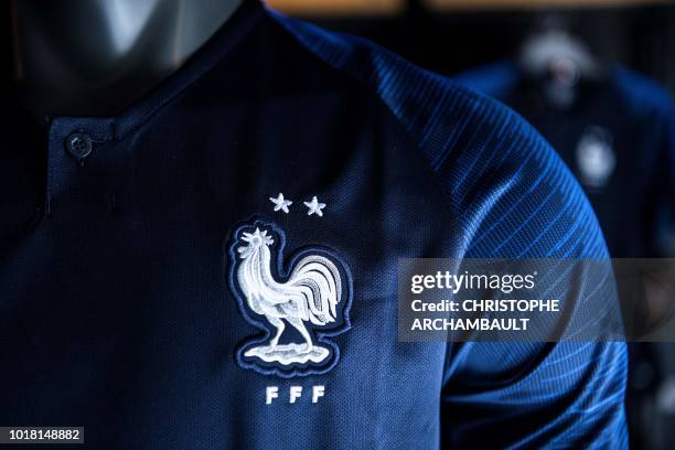 Picture shows the new jersey of the French national football team bearing the two stars of world champion, displayed for sale at the French Football...