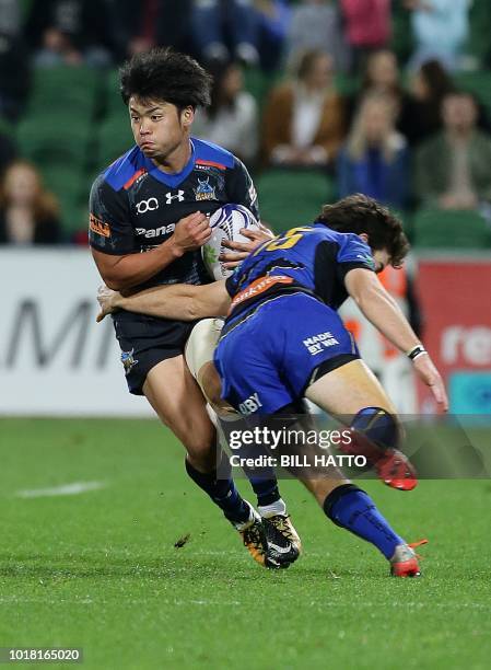 Keisuke Moriya of Japan's Wild Knights is tackled by Jack McGregor from Western Force during their World Series rugby match in Perth on August 17,...