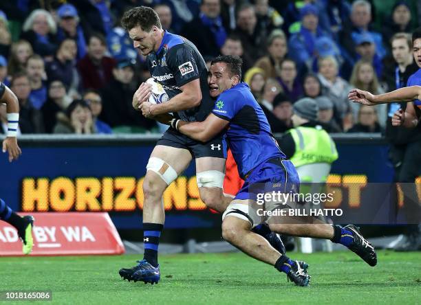 Jack Cornelsen of Japan's Wild Knights is tackled by Tevin Ferris from Western Force during their World Series rugby match in Perth on August 17,...