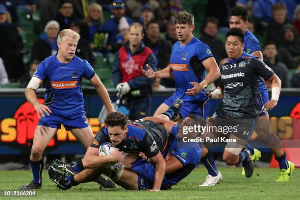 Tevin Ferris of the Force tackles Jack Cornelsen of the Wild Knights during the World Series Rugby match between the Force and Wild Knights at nib...