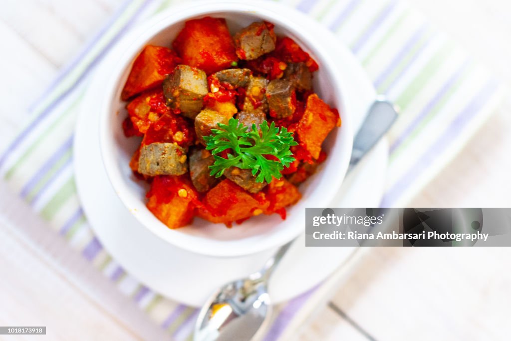 Spicy Stir-Fried potato and liver - Indonesian Food - shot overhead in clean simple styling